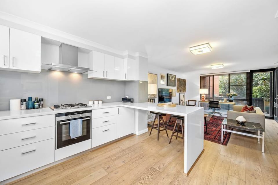 Your perfect urban retreat awaits. Relax in the beautifully styled living area after a day of exploring, and enjoy cooking in the contemporary, white-gloss kitchen.