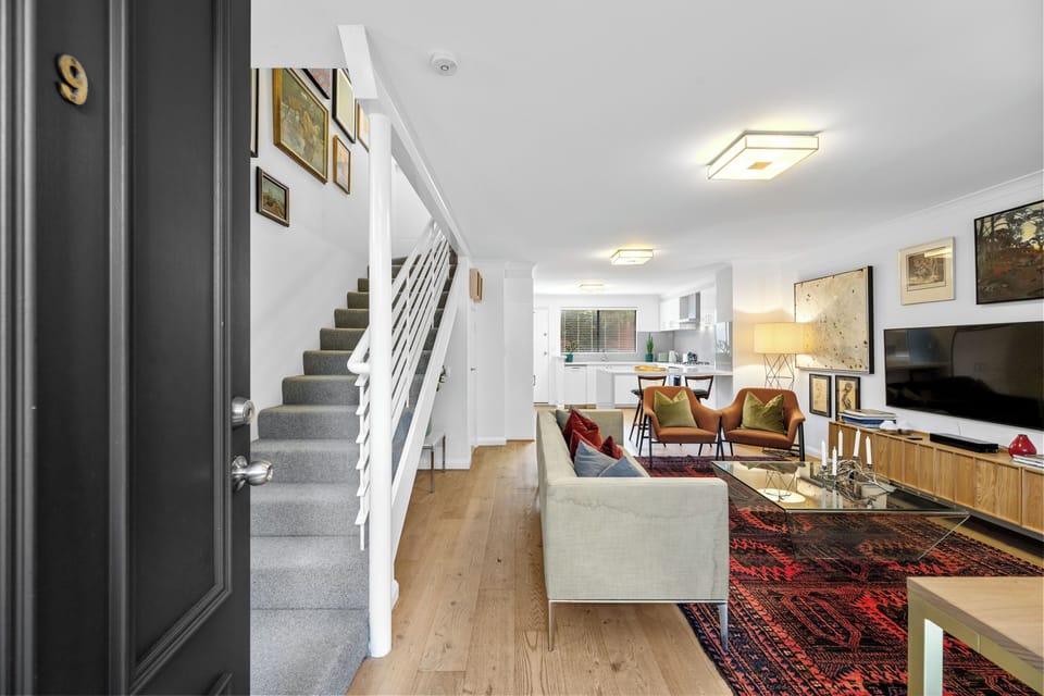 Bright and inviting, this stylish offers a comfortable living space, modern kitchen, and easy access to the upstairs bedrooms. 