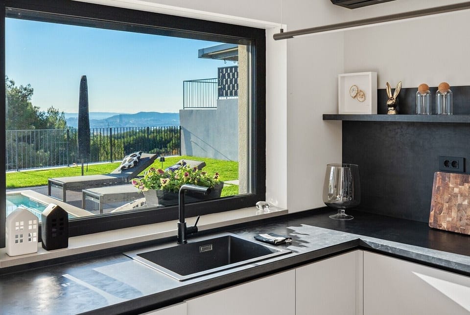 Kitchen window over the sink area offering stunning views of Split and the private outdoor oasis.
