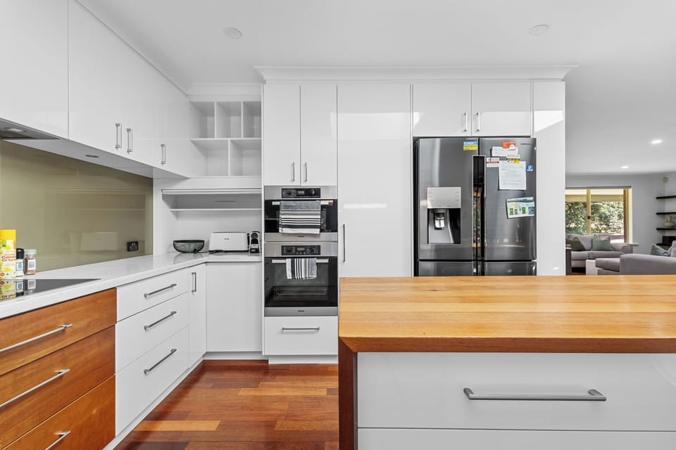Beautifully designed and modern kitchen with two ovens and large french door fridge.