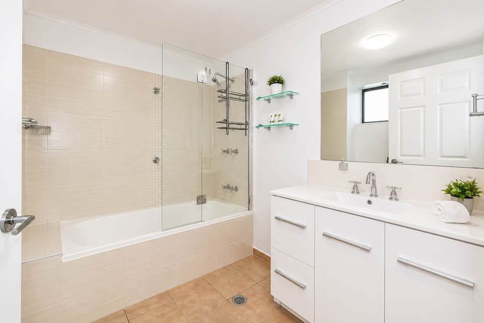 Stylish Bathroom with Shower, Bathtub & Ample Storage
