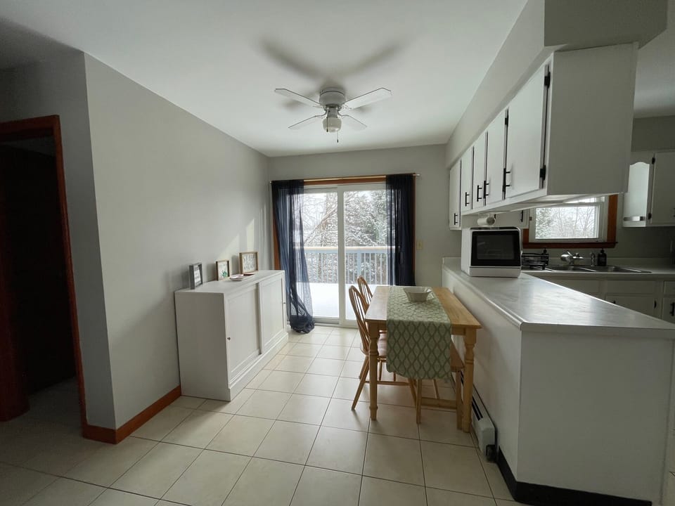 Pull the kitchen table out and find a bench, making this a table for 4 or 5.