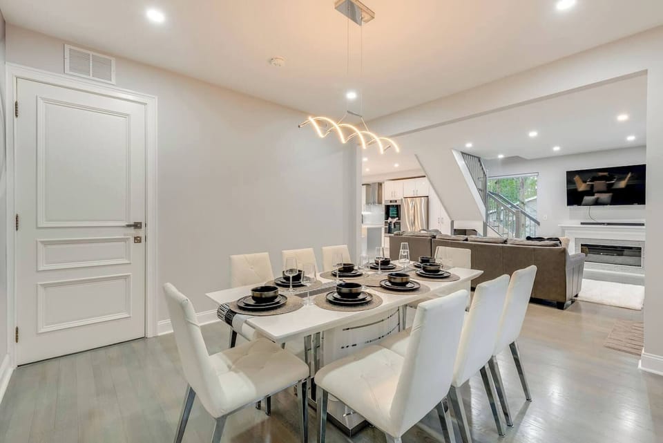 Dining Room: Gather around the sleek table and enjoy unforgettable meals in style!