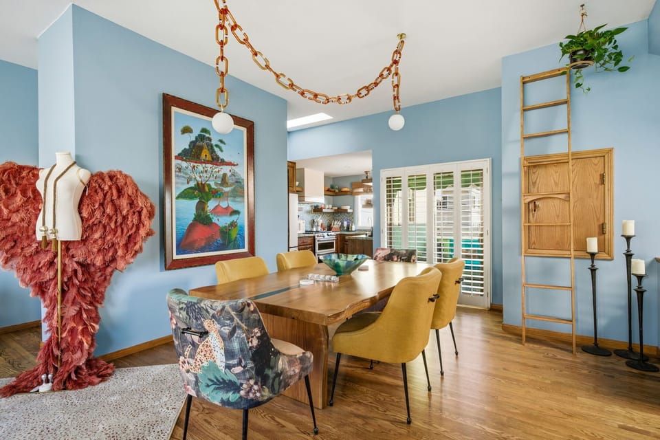 A bright and artful dining space designed for easy gatherings, with playful details and cozy seating that invite conversation.