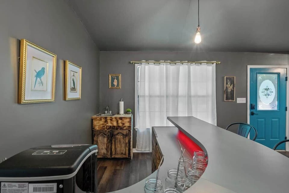 Enjoy meals in this beautifully lit dining space featuring chic artwork and stylish décor.