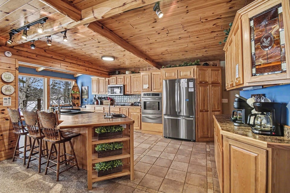 Beautiful cabin-style kitchen with a breakfast nook