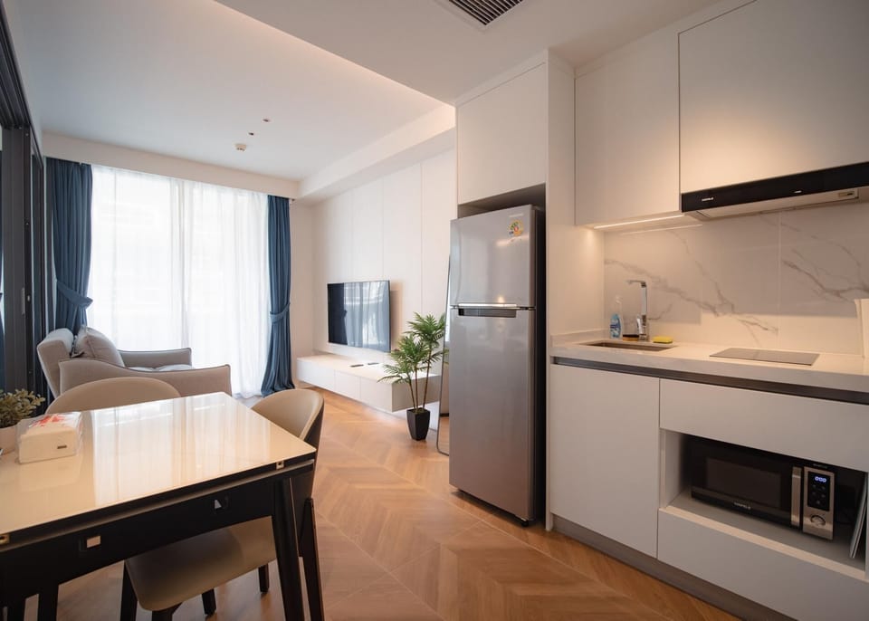 Spacious open-plan living area with modern kitchen and dining space.