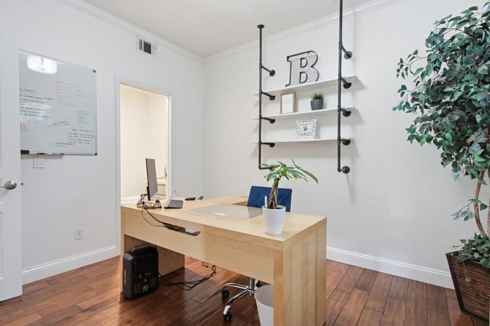 Private home office with desk and workspace