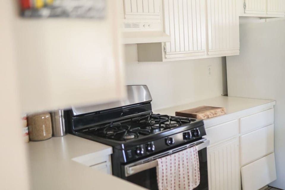 Full kitchen with oven, stove, microwave, dishwasher, toaster oven, and pour‑over coffee setup—fuel your adventures and artistry.