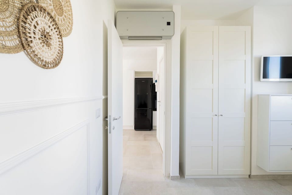 Flooring, Wall, Floor, Interior Design, Wood, Ceiling, Room, Door, Wood Flooring, Lighting