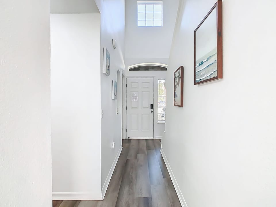 Bright entry hallway welcomes you inside w/ a clean, airy feel.