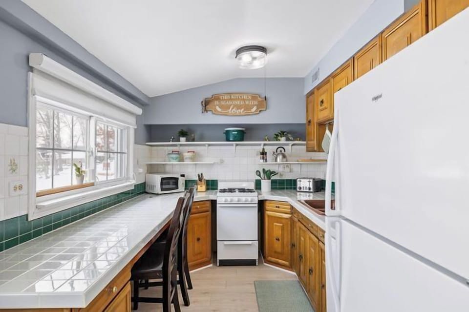 Bright and open kitchen with all the essentials for cooking and gathering.