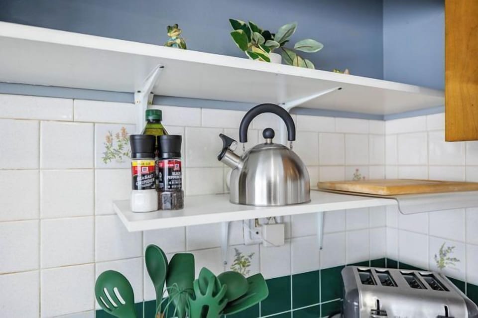 Some of the kitchen amenities include a toaster, electric kettle, cutting board, cooking utensils, and salt & pepper for your convenience.