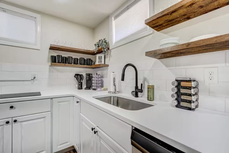 Prepare delicious meals in the fully stocked kitchen, equipped with a cooktop, microwave, dishwasher, and all the cooking utensils you might need.