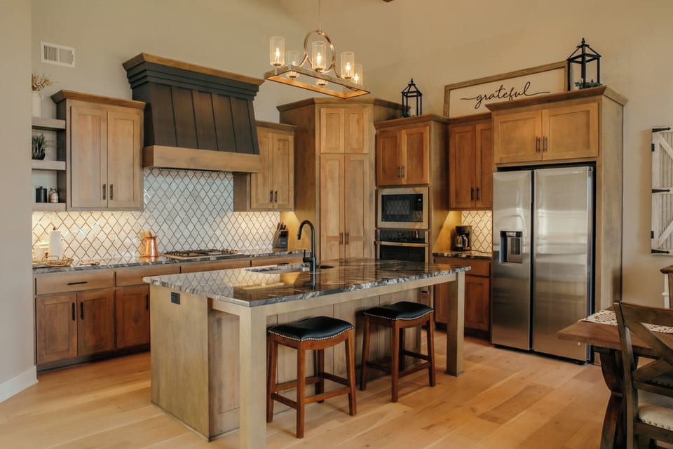 There is plenty of seating at the island and dining table. Guests will love it!