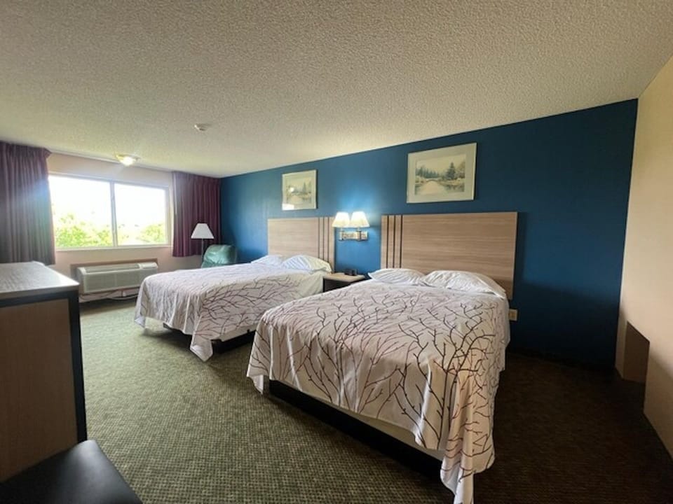 Drift off comfortably in a roomy double-queen setup.