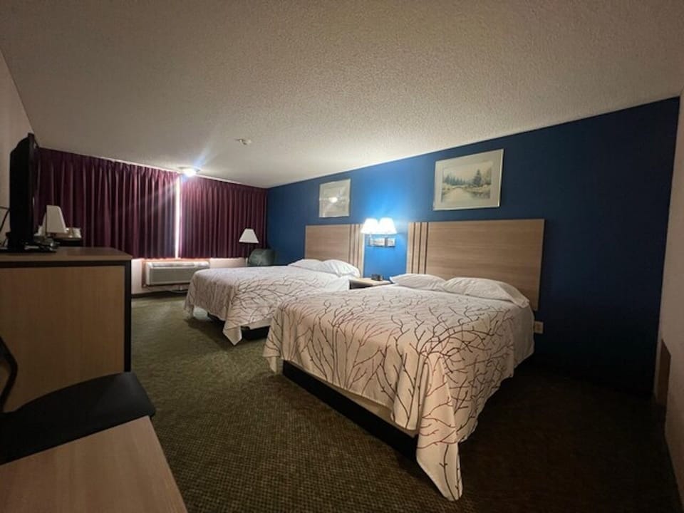 Kick back with TV, desk space, and easy in-room convenience.