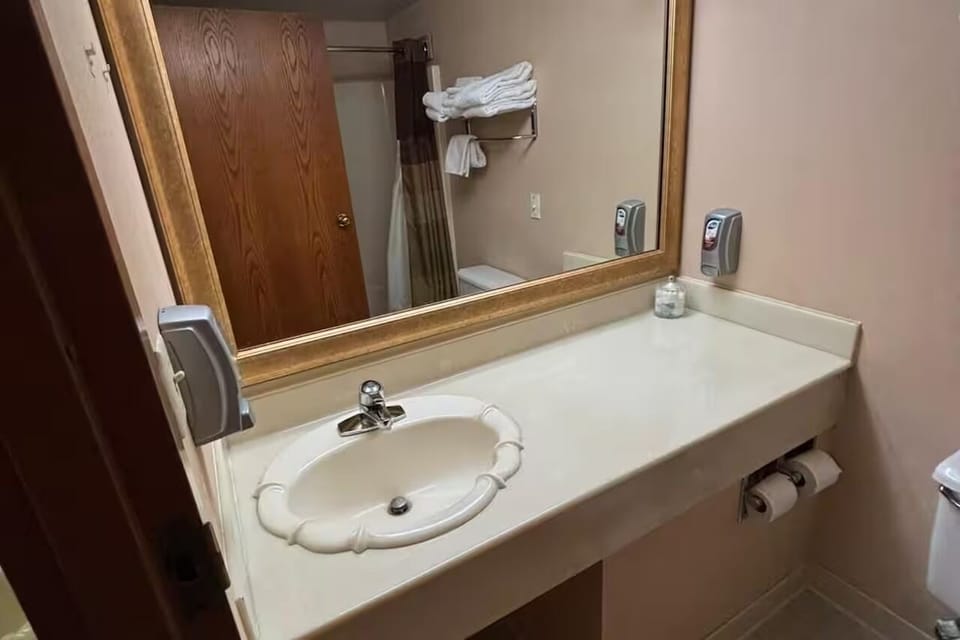 Refresh effortlessly at the spacious vanity with bright mirror lighting.