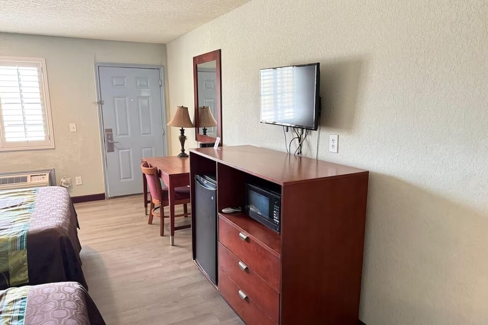 Settle in with TV, mini-fridge, and easy unpacking space.