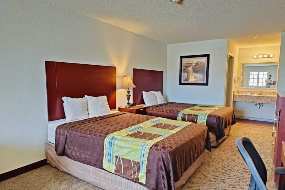 Rest comfortably with two beds and convenient in-room vanity.