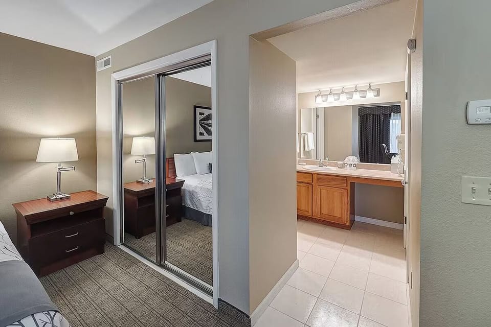 Wake up refreshed with a serene bedroom and easy vanity access.