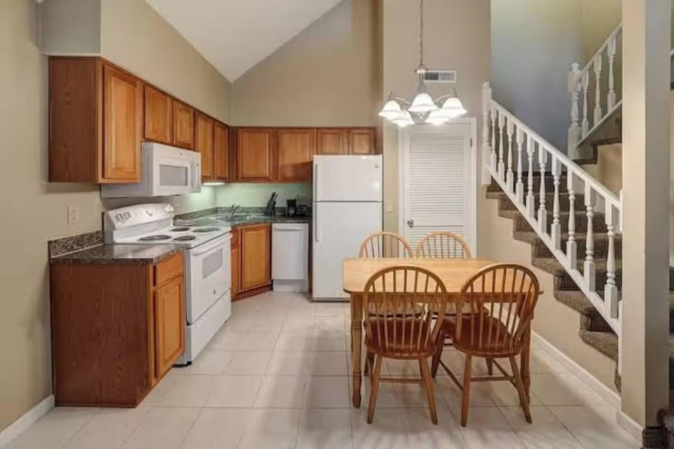Cook together in the bright kitchen with dining for four.