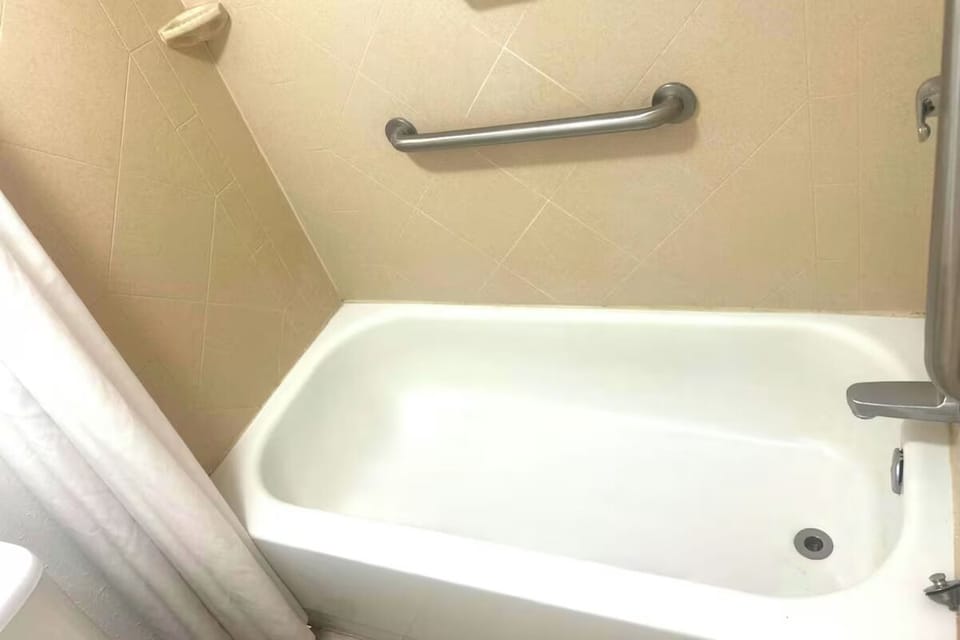Unwind with a soothing soak in the clean tub.