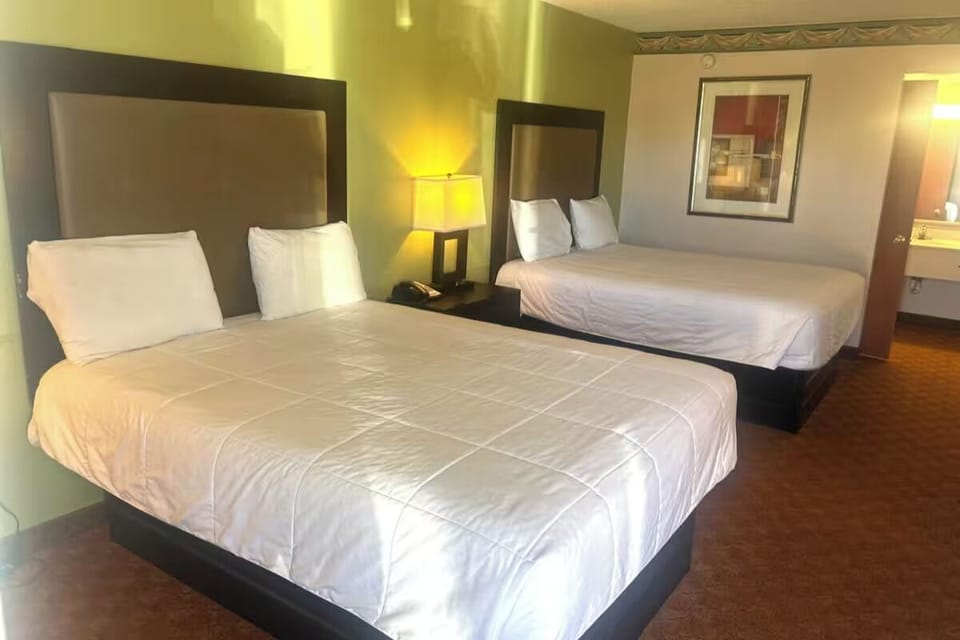 Relax together in two cozy beds with soft, warm lighting.
