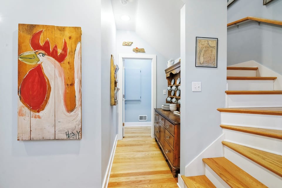 Easy flow between levels with artful Harbor Country touches.