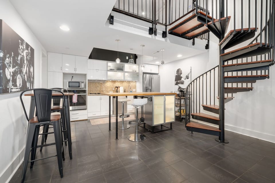 Inside, there is fully stocked kitchen with bar seating for 2