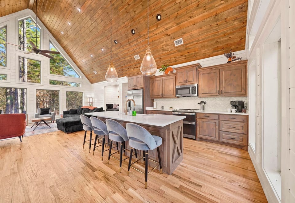 Open kitchen with ample counter space and bar seating.