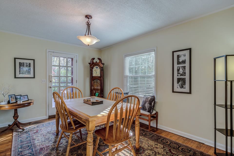 South unit dining area with back door leading to deck and North Unit Access