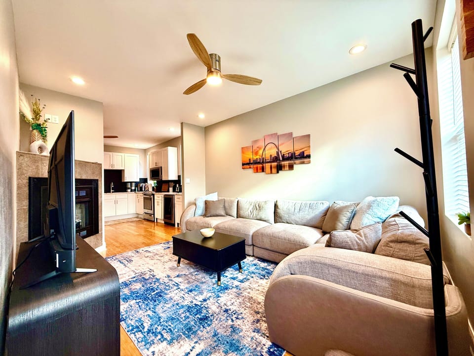 A 65" smart TV, lift table with games, and charing ports in the sectional. 