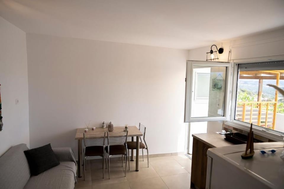 Dining and living space with clean, modern design