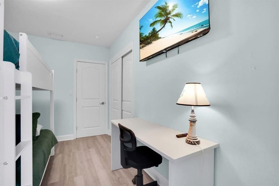 All bedrooms feature cozy beds and individual TVs, perfect for relaxing and enjoying private entertainment.