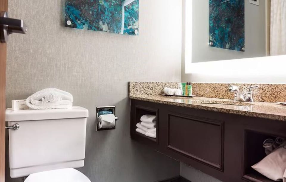 Refresh easily with a bright vanity and plush towel storage.