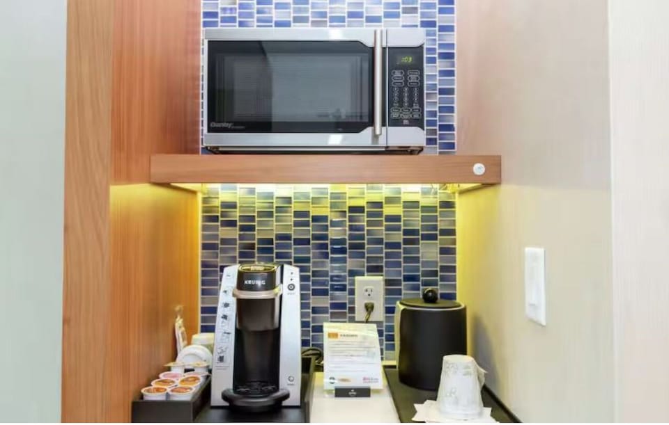 Start mornings with fresh coffee and convenient in-room snacks.
