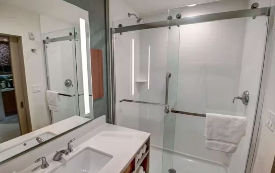 Enjoy an easy, refreshing shower in a spotless modern bath.