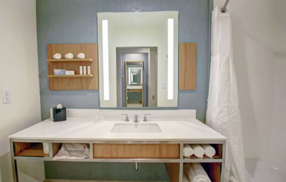 Get ready with bright vanity lighting and generous counter space.