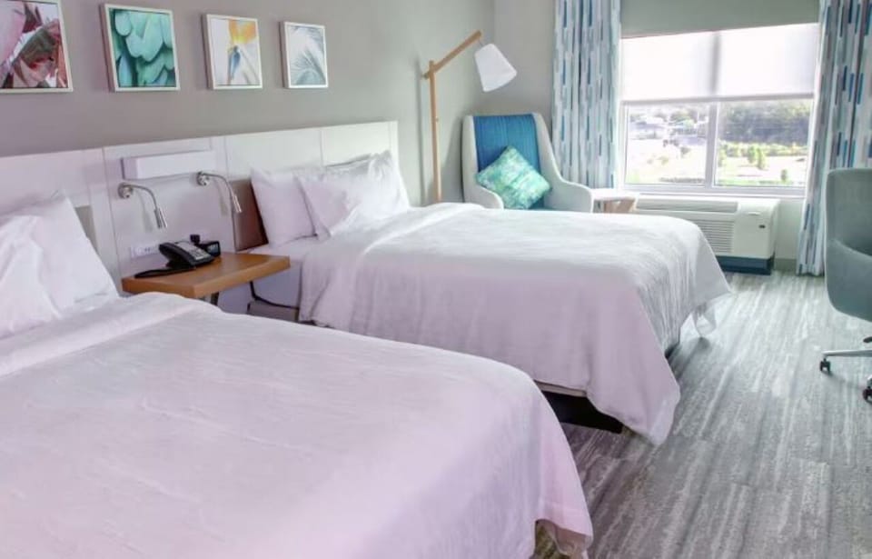 Wake up to soft daylight and comfy beds made for rest.