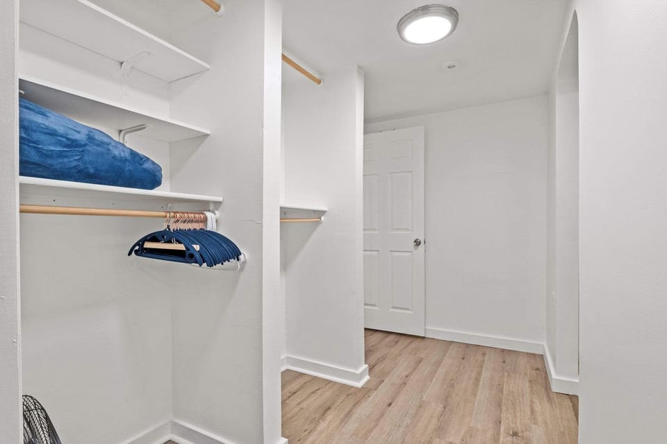 Master bedroom with ensuite bath, king bed, smart tv.