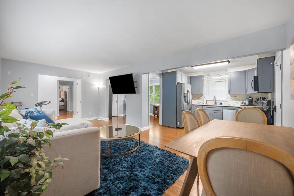 Open floor plan concept featuring living, dining area, kitchen, and workspace