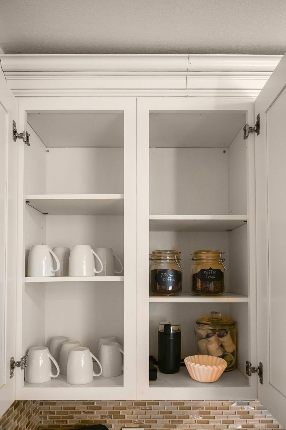 Morning essentials: Mugs and coffee neatly stocked in the kitchen drawer for your convenience