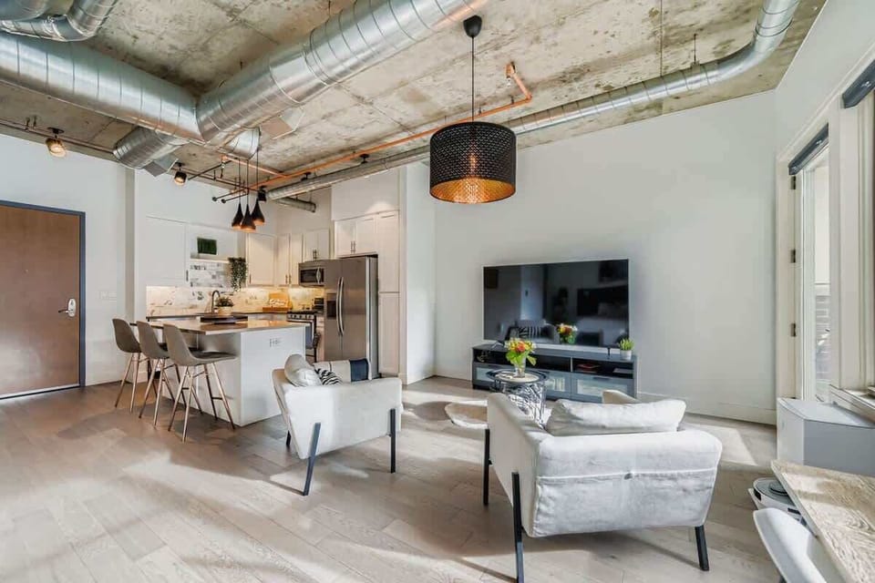 Step into a sunlit kitchen as you enter the studio, with modern appliances and a warm, inviting layout ready for cooking and entertaining.