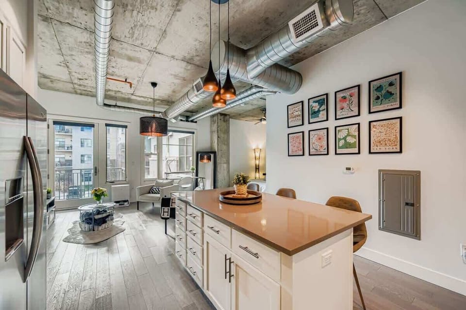 Open-plan layout that welcomes you from the front door, seamlessly connecting the kitchen, living, and sleeping areas.