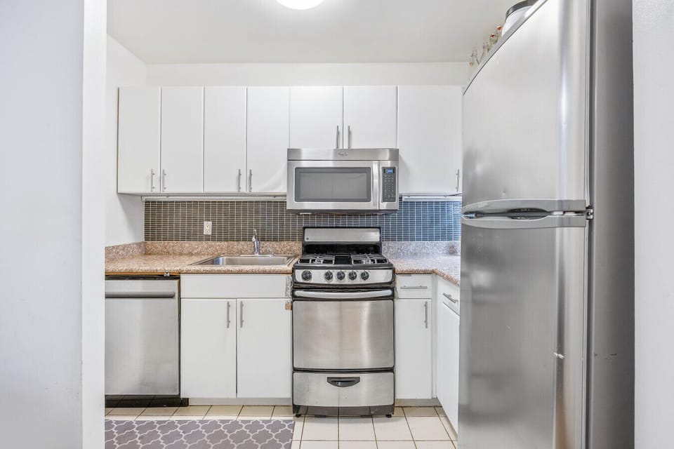 Compact Kitchen | Stainless Steel Appliances | Granite Countertops