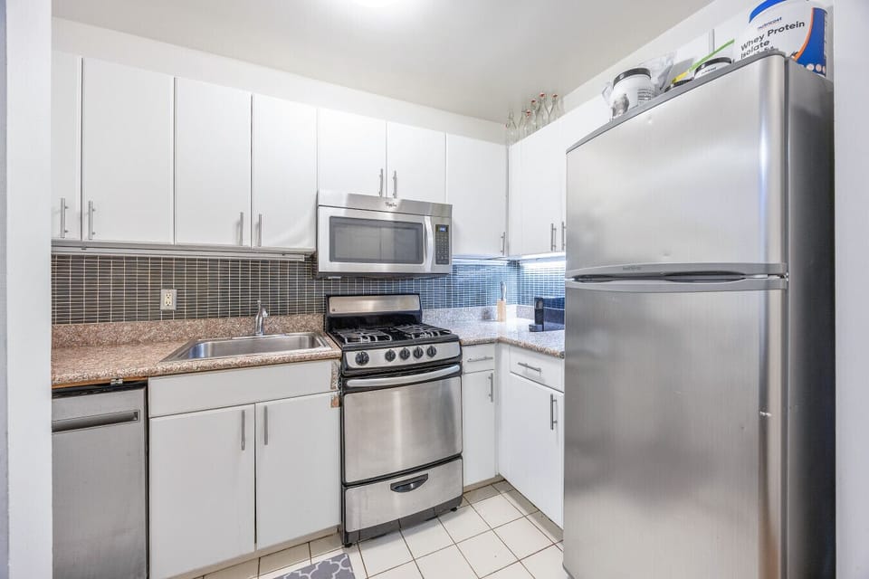 Compact Kitchen | Stainless Steel Appliances | Granite Countertops