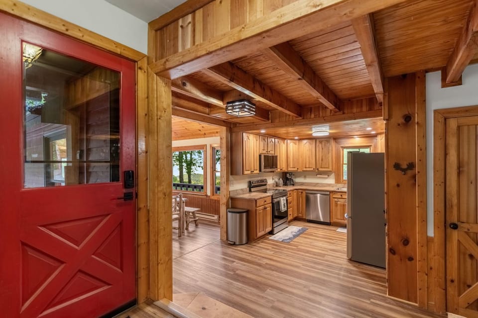 Foyer and fully stocked kitchen leads to amazing views in dining room