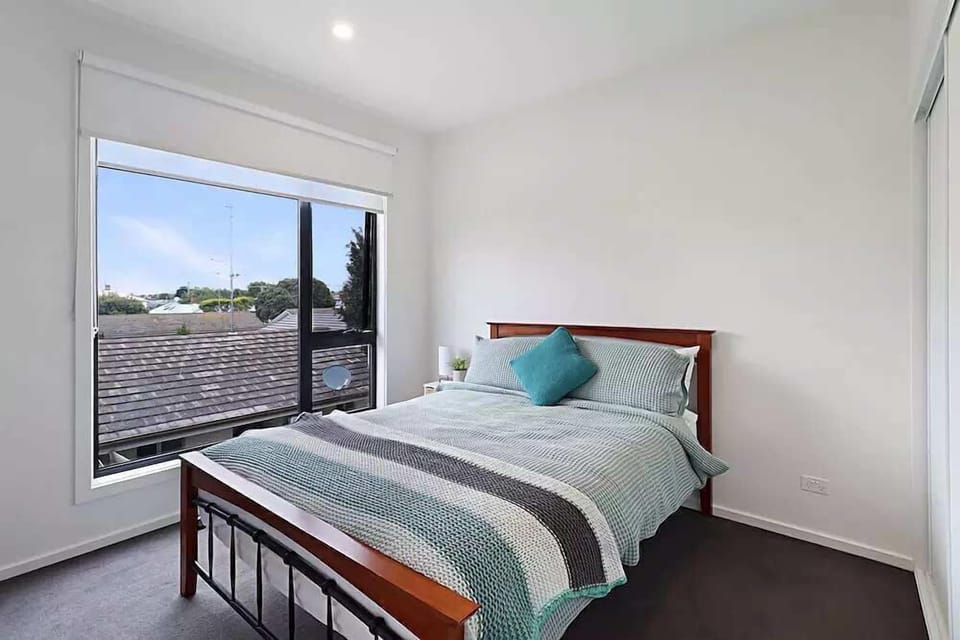 Bedroom 2 with queen size bed and storage