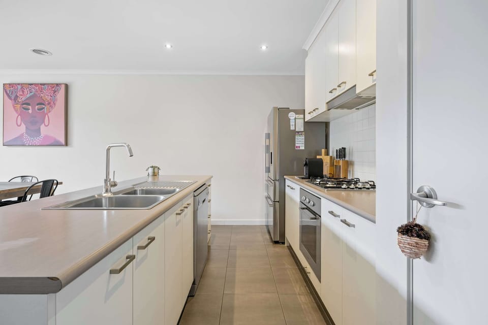 Fully equipped kitchen with fridge, oven, stove and more.